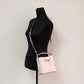 Suri Small Dark Powder Blush Signature PVC Bucket Crossbody Handbag