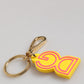 Yellow Rubber Gold Tone Metal DG Logo Keyring Keychain